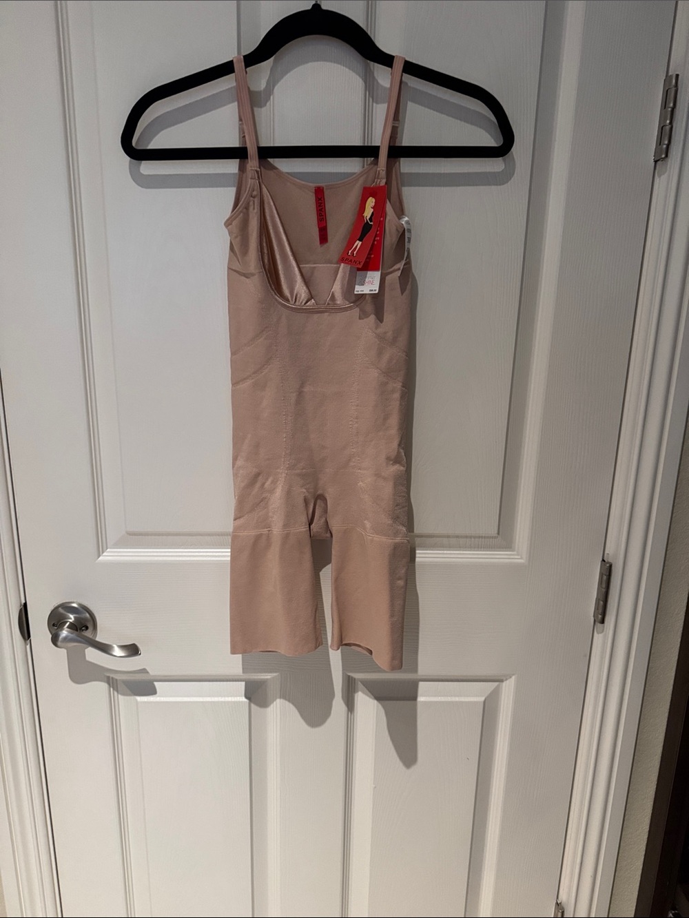 NWT size small SPANX Seamless One-Piece Bodysuit in rose gold.